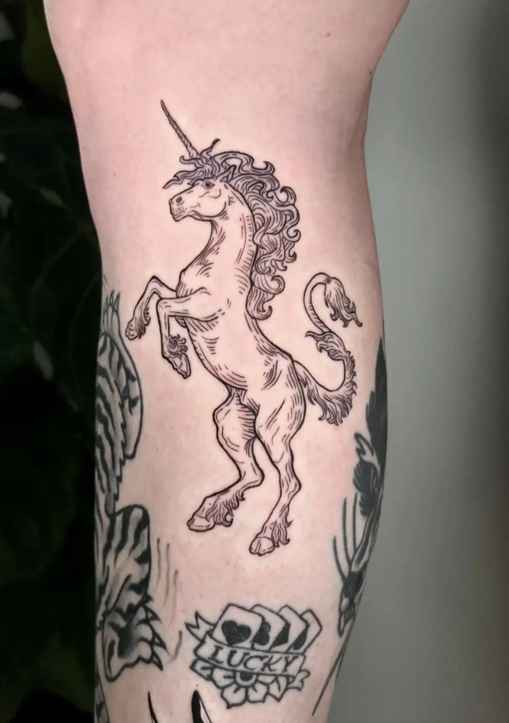 Rearing unicorn tattoo with detailed mane and horn by Ayah at Omnia Tattoo Melbourne